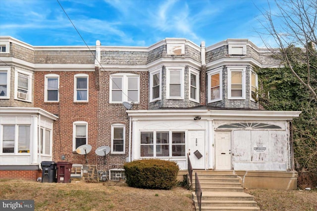 view of property featuring brick siding