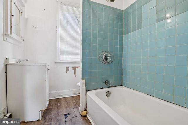 full bathroom featuring vanity, toilet, wood finished floors, and baseboards