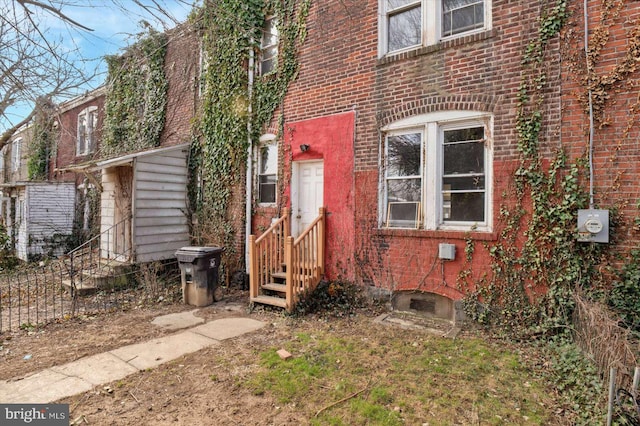 view of front of home featuring brick siding and entry steps