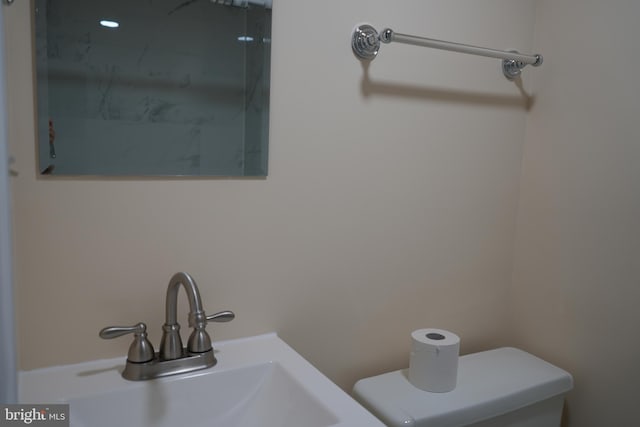 bathroom with a sink and toilet