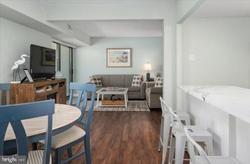 dining room featuring visible vents and wood finished floors