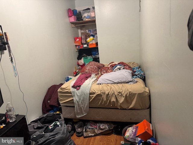 bedroom with wood finished floors