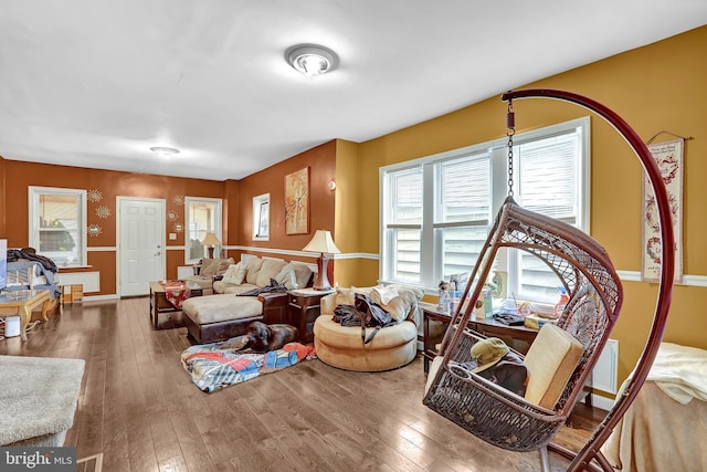 living room with baseboards and wood-type flooring