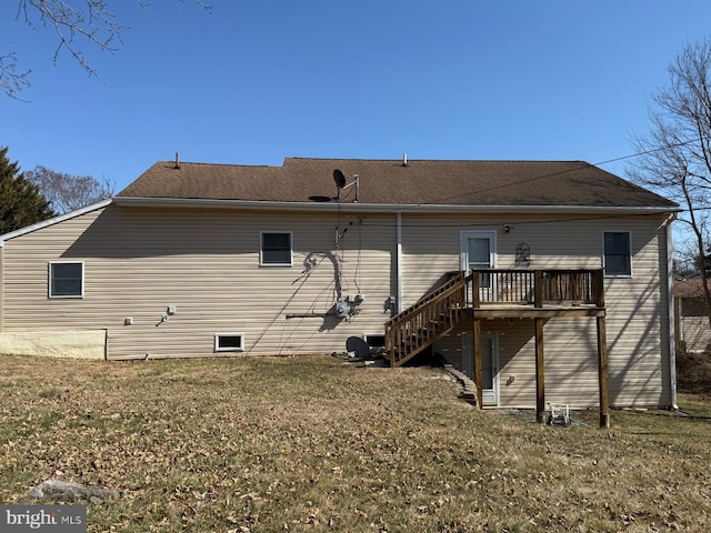 back of house with a wooden deck, a yard, and stairway