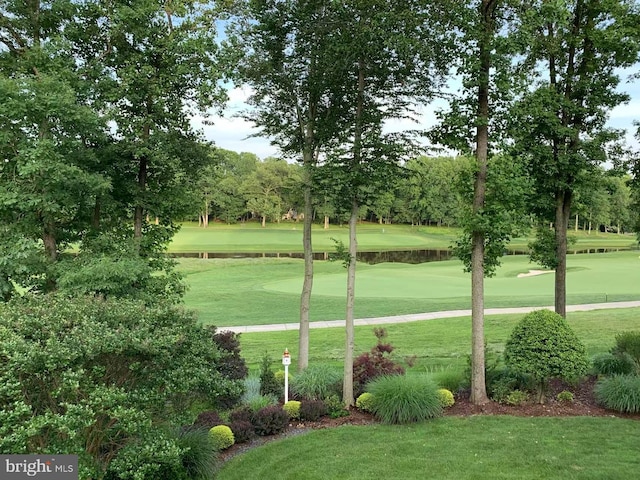 surrounding community with a lawn and golf course view