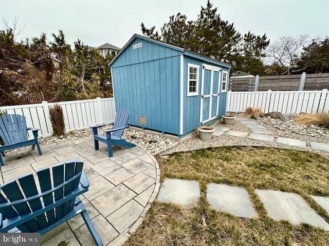 1 E Essex St, Fenwick Island, DE 19944 - view of shed featuring a fenced backyard