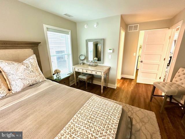 1 E Essex St, Fenwick Island, DE 19944 - bedroom featuring wood finished floors and baseboards