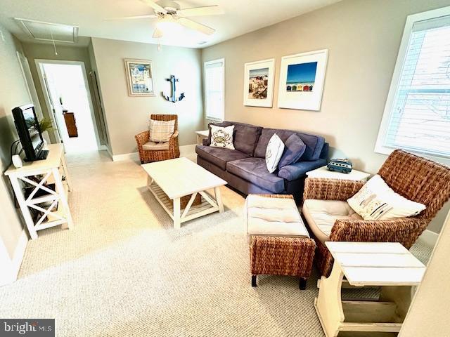 1 E Essex St, Fenwick Island, DE 19944 - carpeted living room featuring attic access and ceiling fan
