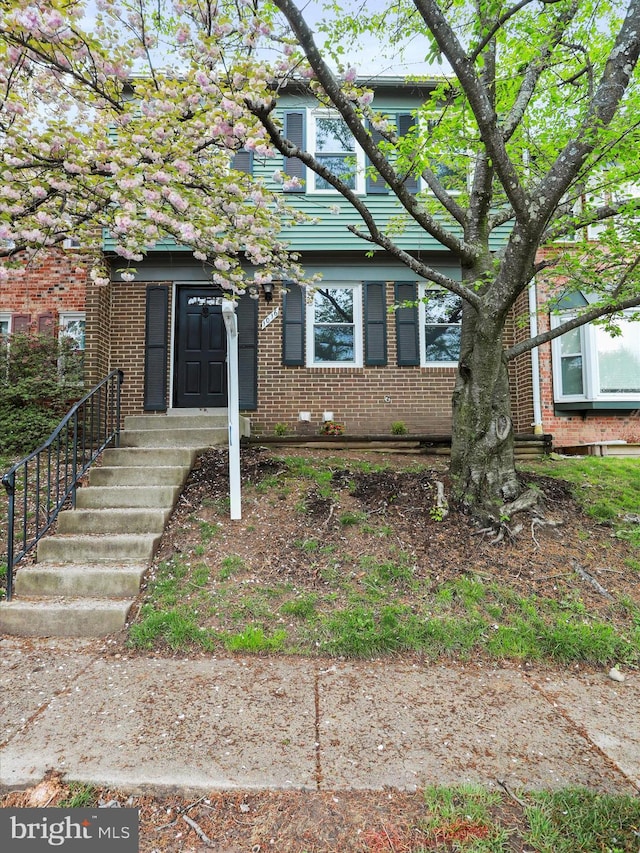 view of front of property featuring brick siding
