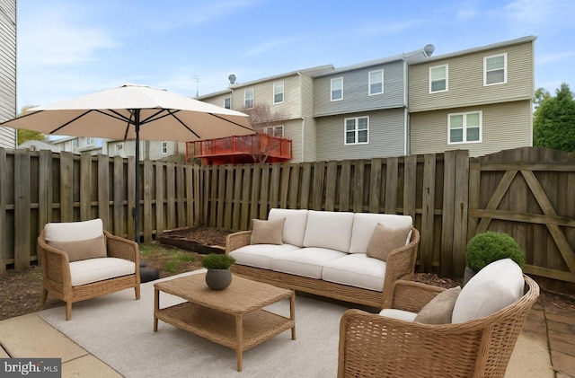 view of patio / terrace featuring a fenced backyard and an outdoor living space