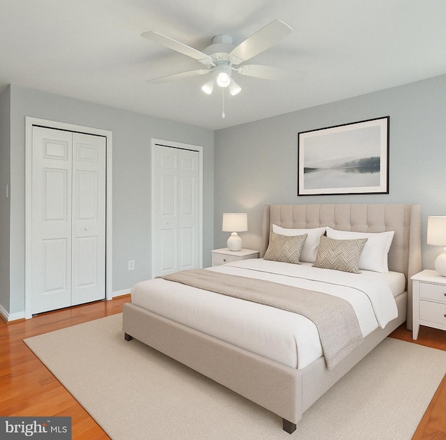bedroom with multiple closets, baseboards, a ceiling fan, and light wood-style flooring