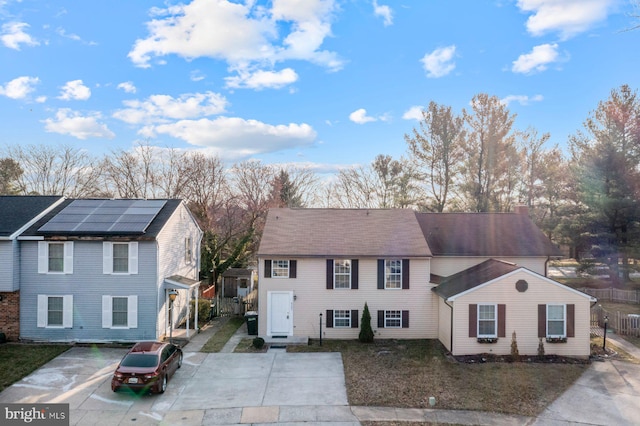 view of front of house with solar panels