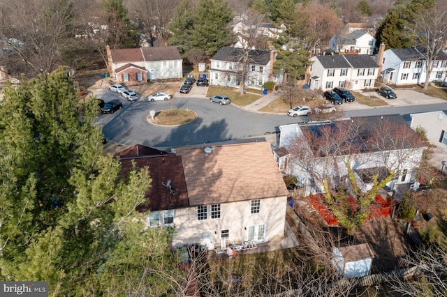 birds eye view of property with a residential view