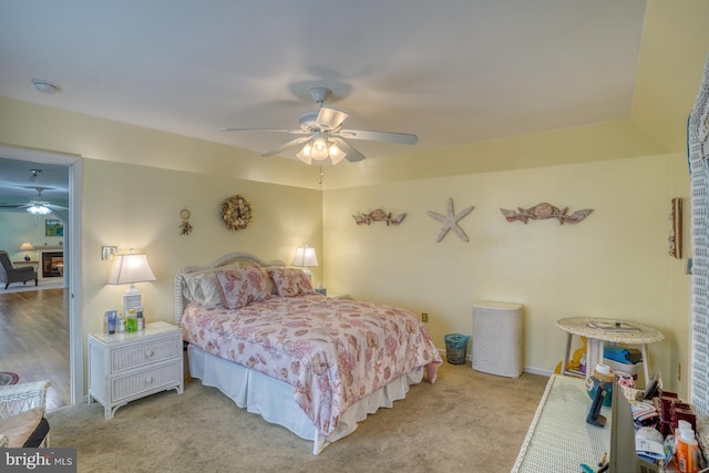 carpeted bedroom with ceiling fan