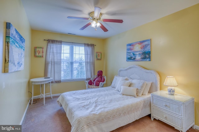 carpeted bedroom featuring visible vents, ceiling fan, and baseboards