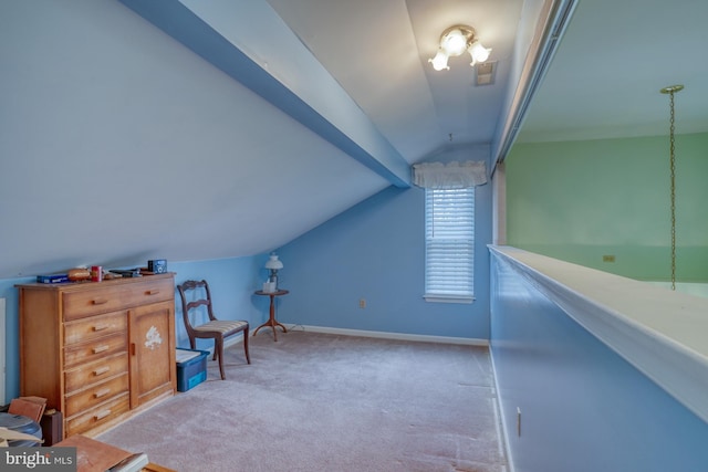 interior space featuring baseboards, vaulted ceiling with beams, and carpet