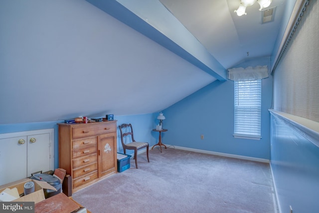 interior space featuring visible vents, baseboards, lofted ceiling, and carpet