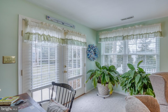 carpeted home office featuring visible vents, baseboards, and french doors