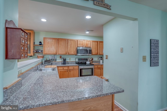 kitchen with visible vents, a sink, open shelves, recessed lighting, and stainless steel appliances