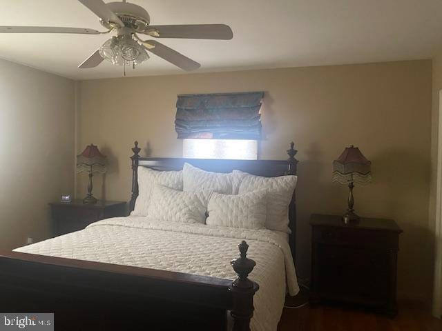 bedroom with wood finished floors and a ceiling fan