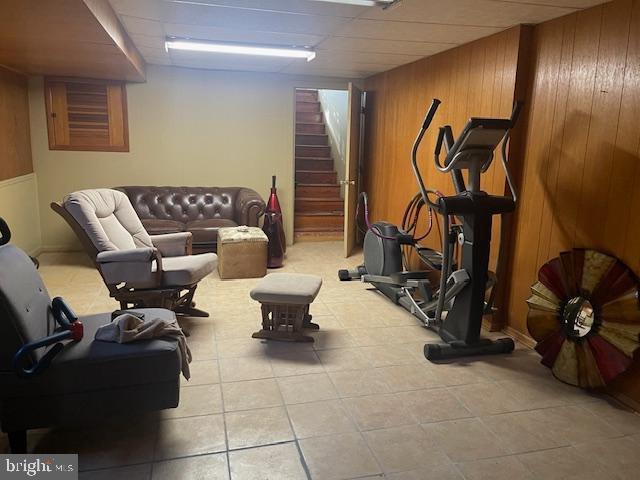 exercise room featuring wooden walls