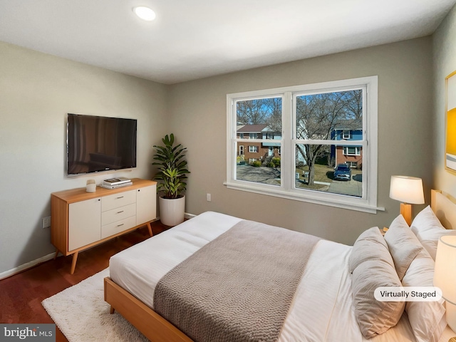 bedroom with recessed lighting, baseboards, and dark wood finished floors