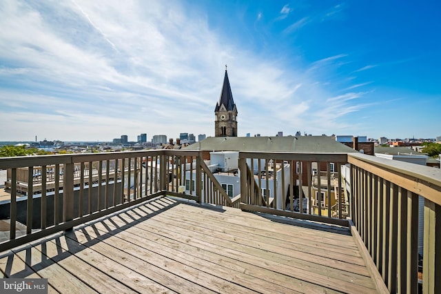 wooden deck with a city view