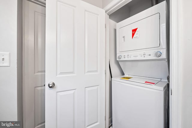 washroom with laundry area and stacked washing maching and dryer