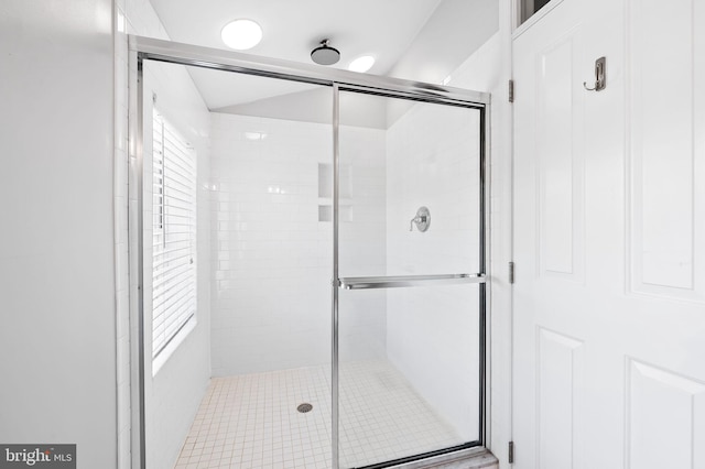 bathroom featuring a shower stall