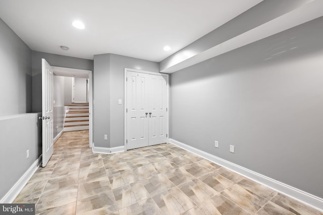 below grade area featuring recessed lighting and baseboards