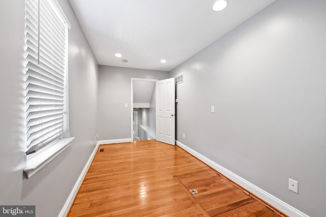 interior space featuring visible vents, recessed lighting, baseboards, and light wood finished floors