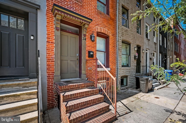 entrance to property with brick siding