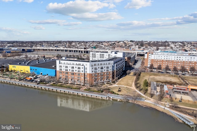 drone / aerial view featuring a city view and a water view