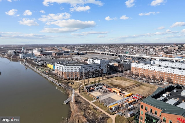 birds eye view of property featuring a water view and a view of city