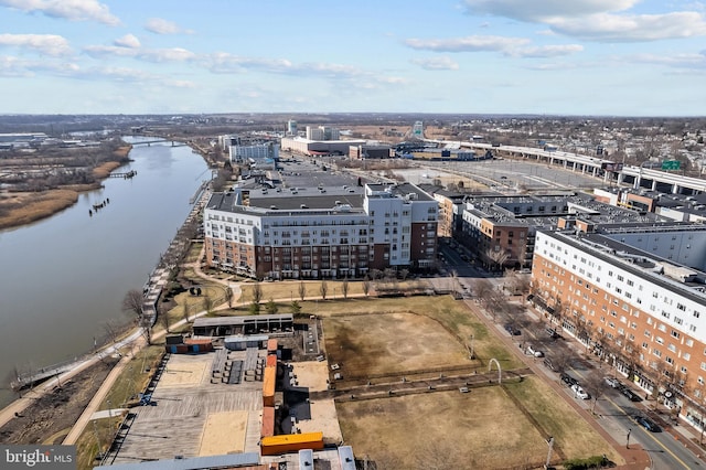 birds eye view of property featuring a water view and a view of city