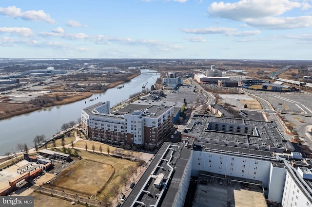 birds eye view of property featuring a city view and a water view