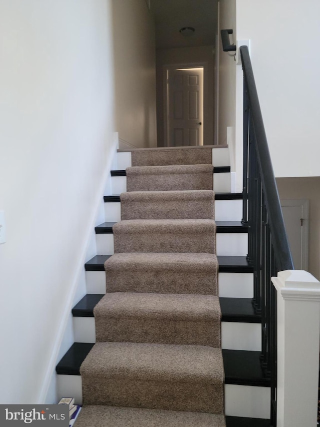 staircase with baseboards