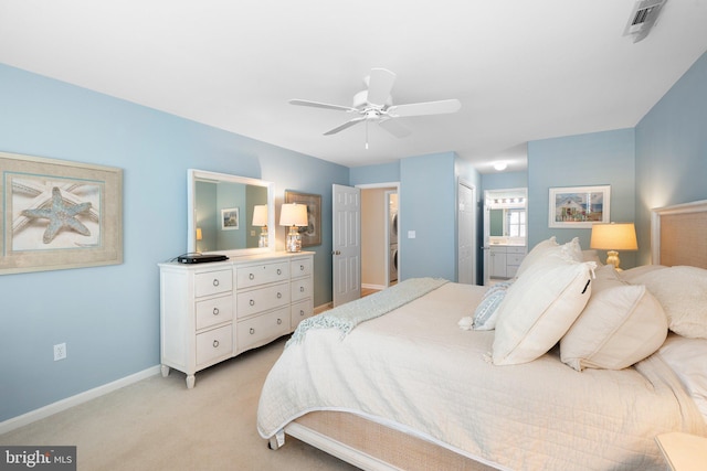 bedroom featuring visible vents, connected bathroom, baseboards, ceiling fan, and light carpet