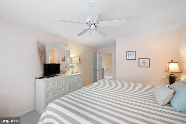 bedroom featuring baseboards and ceiling fan