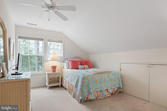 bedroom with visible vents, carpet, ceiling fan, and vaulted ceiling