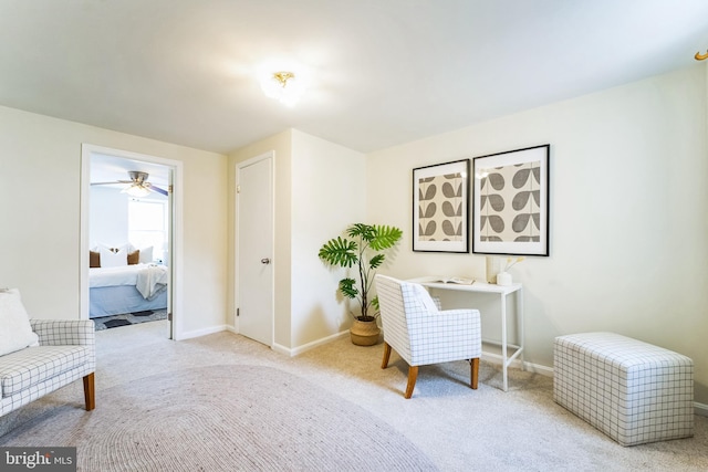 carpeted office featuring baseboards