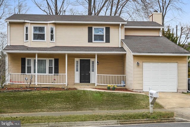 traditional-style home featuring a garage, a front lawn, a porch, and a chimney