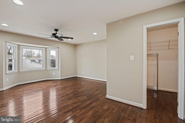 interior space with recessed lighting, baseboards, dark wood-type flooring, and ceiling fan