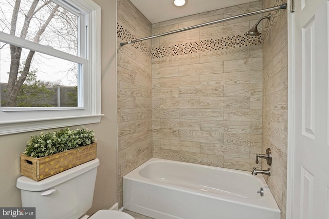 bathroom with shower / tub combination and toilet