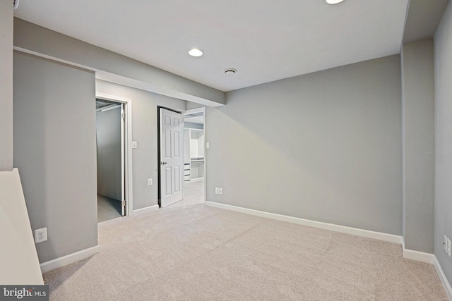 unfurnished bedroom with recessed lighting, baseboards, and carpet floors