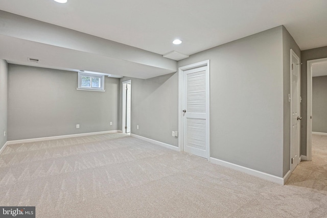 below grade area with visible vents, recessed lighting, carpet, and baseboards