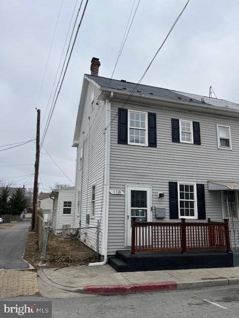 townhome / multi-family property with a chimney