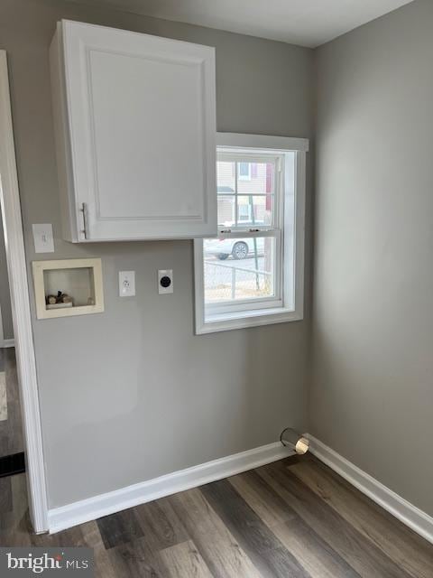 laundry area with hookup for a washing machine, baseboards, hookup for an electric dryer, cabinet space, and dark wood-style flooring