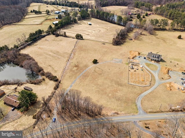 birds eye view of property featuring a rural view