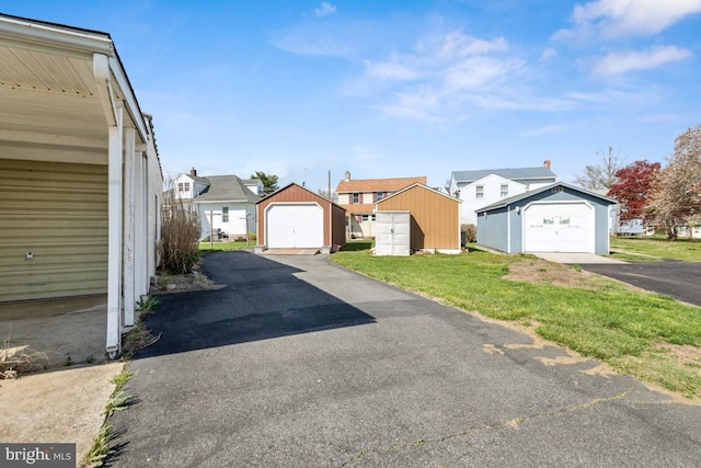 view of road with a residential view and driveway
